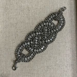 This gorgeous silver bracelet with “diamond” details makes any outfit sparkle!